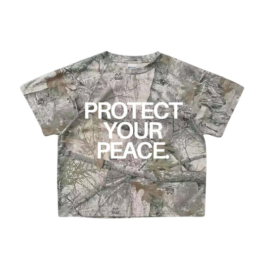 Camouflage-patterned t-shirt with 'PROTECT YOUR PEACE.' text on a white background