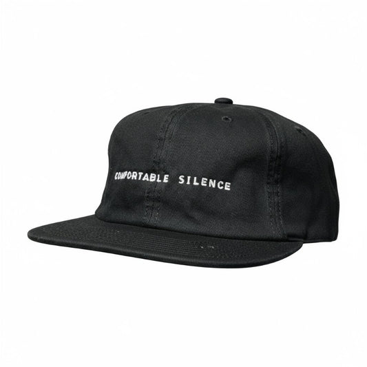 Black cap with 'Comfortable Silence' text on a white background