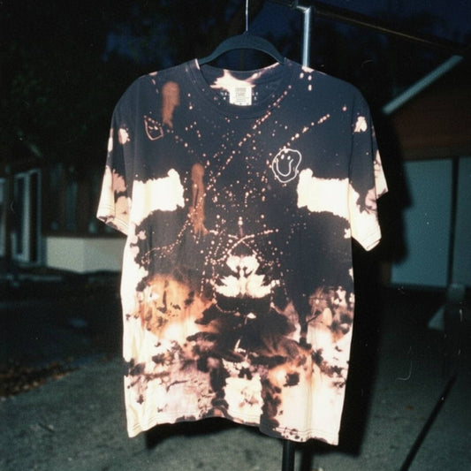 Tie-dye t-shirt on a hanger with a dark background