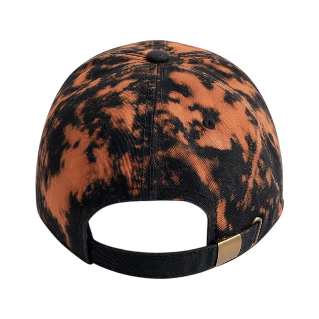 A baseball cap viewed from the back, featuring a black and orange mottled tie-dye pattern with a black adjustable strap and a small gold metal accent.