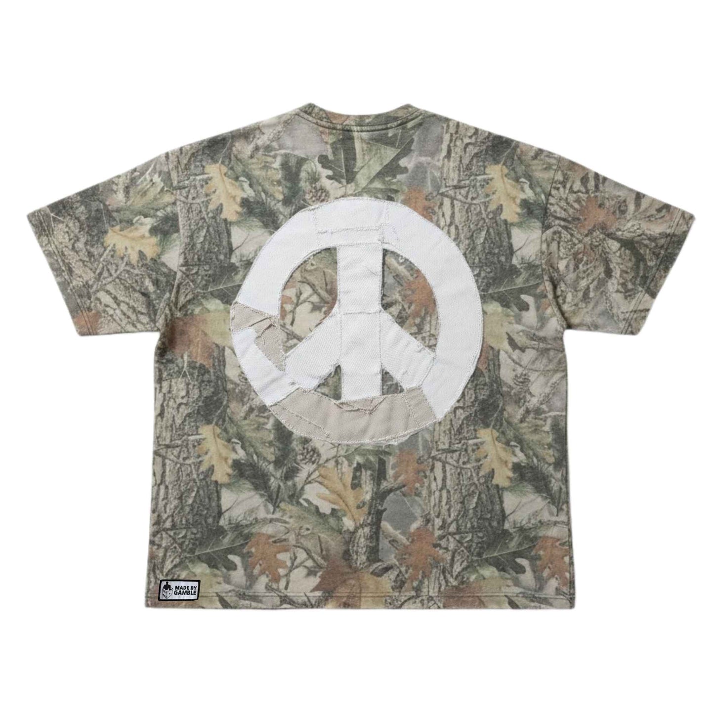 DG Gamble x Comfortable Silence one-of-one camouflage t-shirt with hand-sewn denim patchwork peace sign on back on a white background