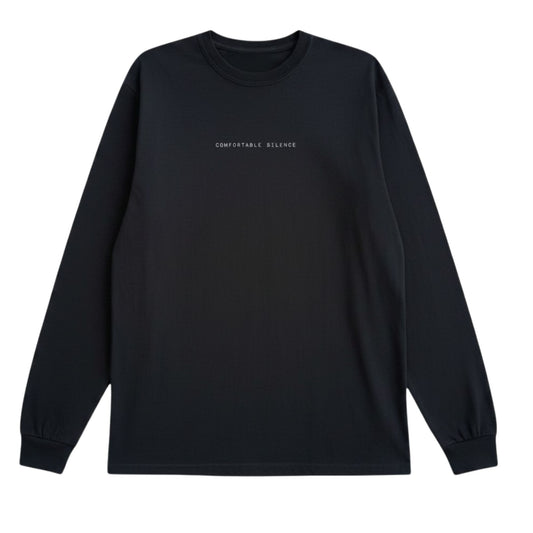 Black long-sleeve shirt with 'Comfortable Silence' text on a white background