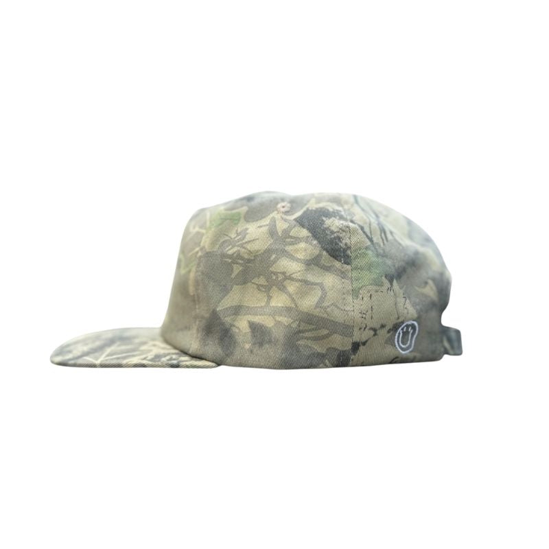 Camouflage-patterned cap with a logo on a white background