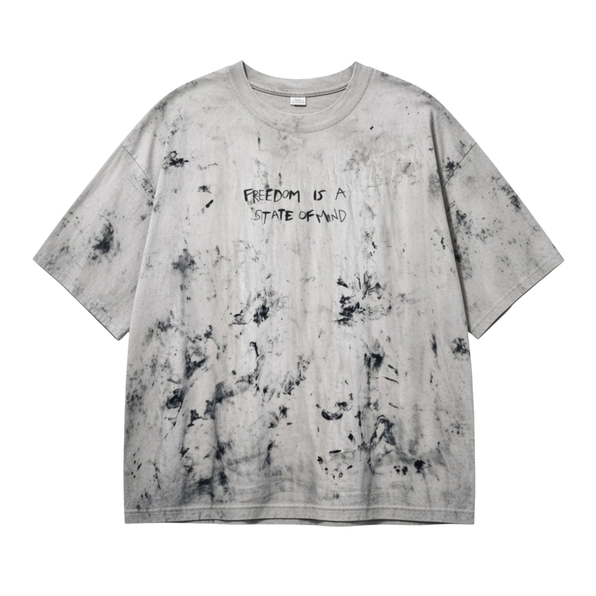 A light gray oversized short-sleeve t-shirt with a black mineral-wash distressed pattern and the text 'FREEDOM IS A STATE OF MIND' printed on the chest, shown flat against a white background.