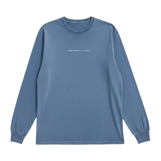 Blue long-sleeve shirt with Comfortable Silence text on a white background