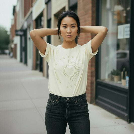 Woman wearing a white t-shirt with a design on a city street