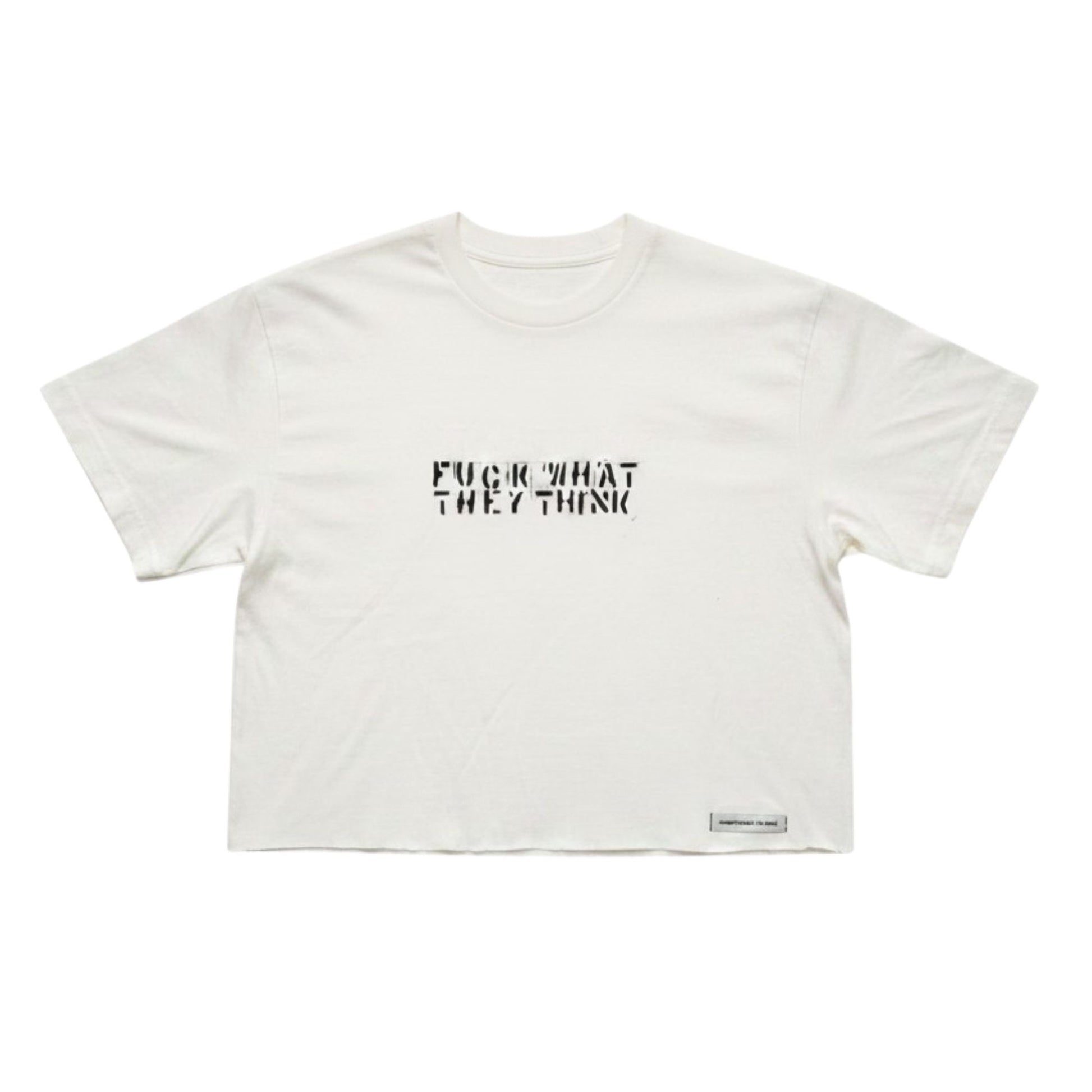 An off-white cropped t-shirt with the text 'FUCK WHAT THEY THINK' printed in black across the chest, displayed flat against a white background.